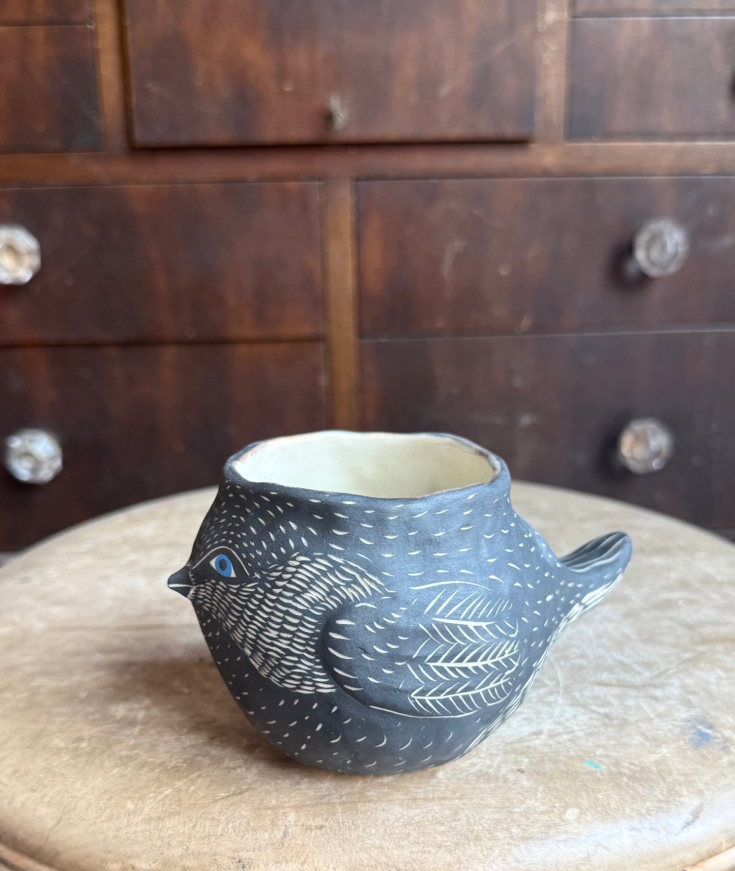 Bird in the hand sculpture mug