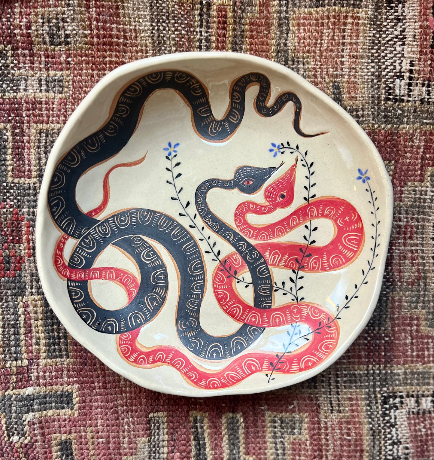 Red and black serving bowl