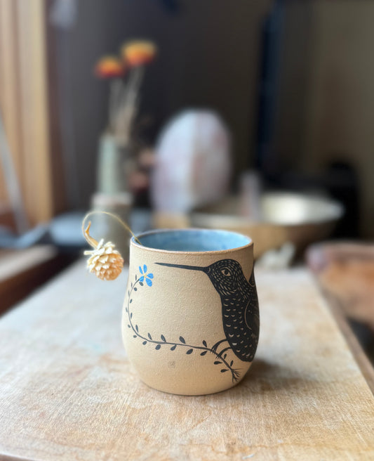 Hummingbird with forget me not