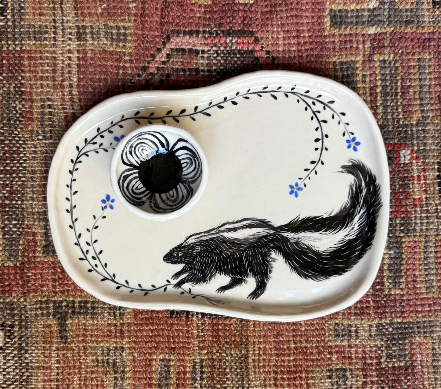 Skunk snack plate with condiment bowl