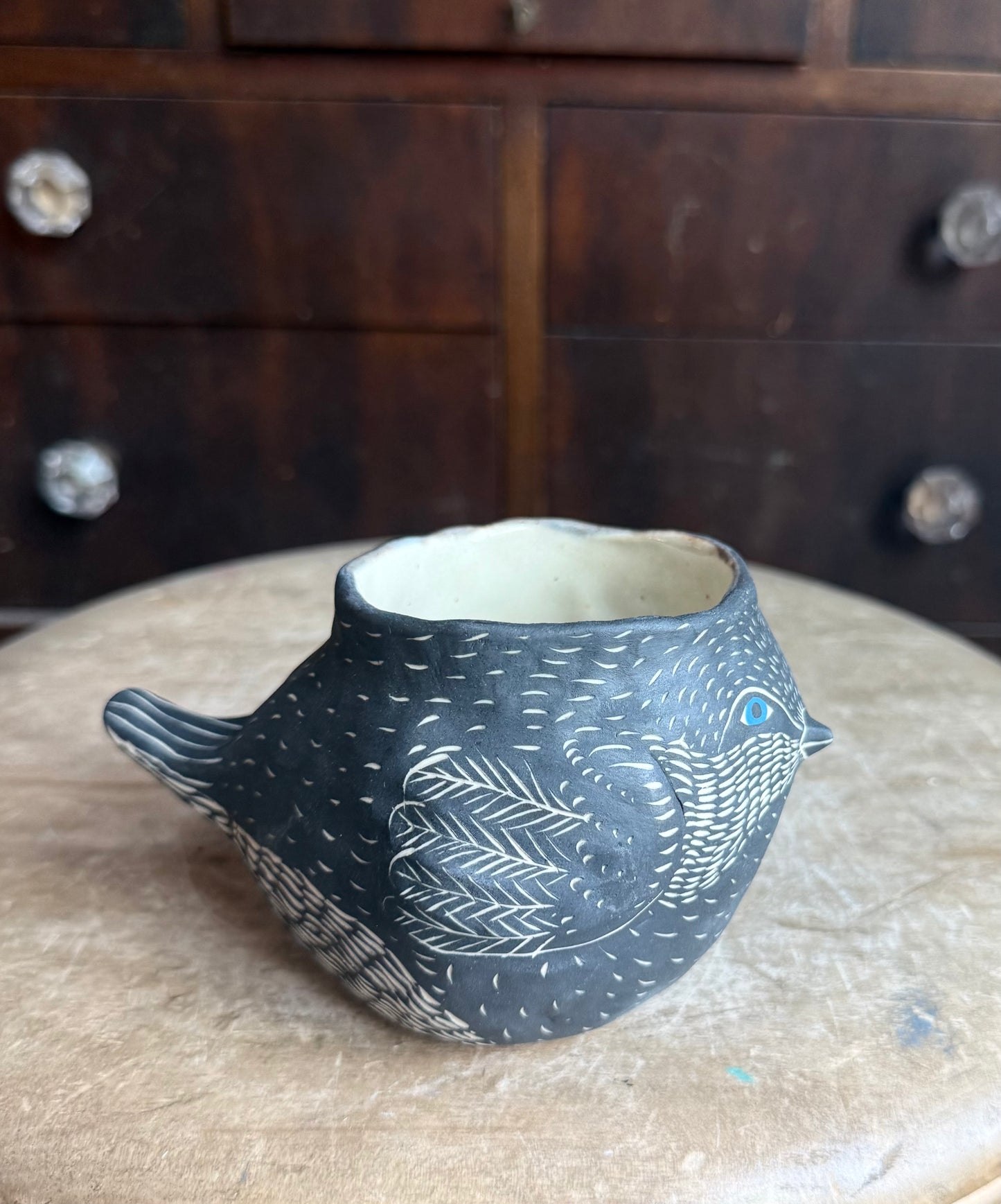 Bird in the hand sculpture  mug