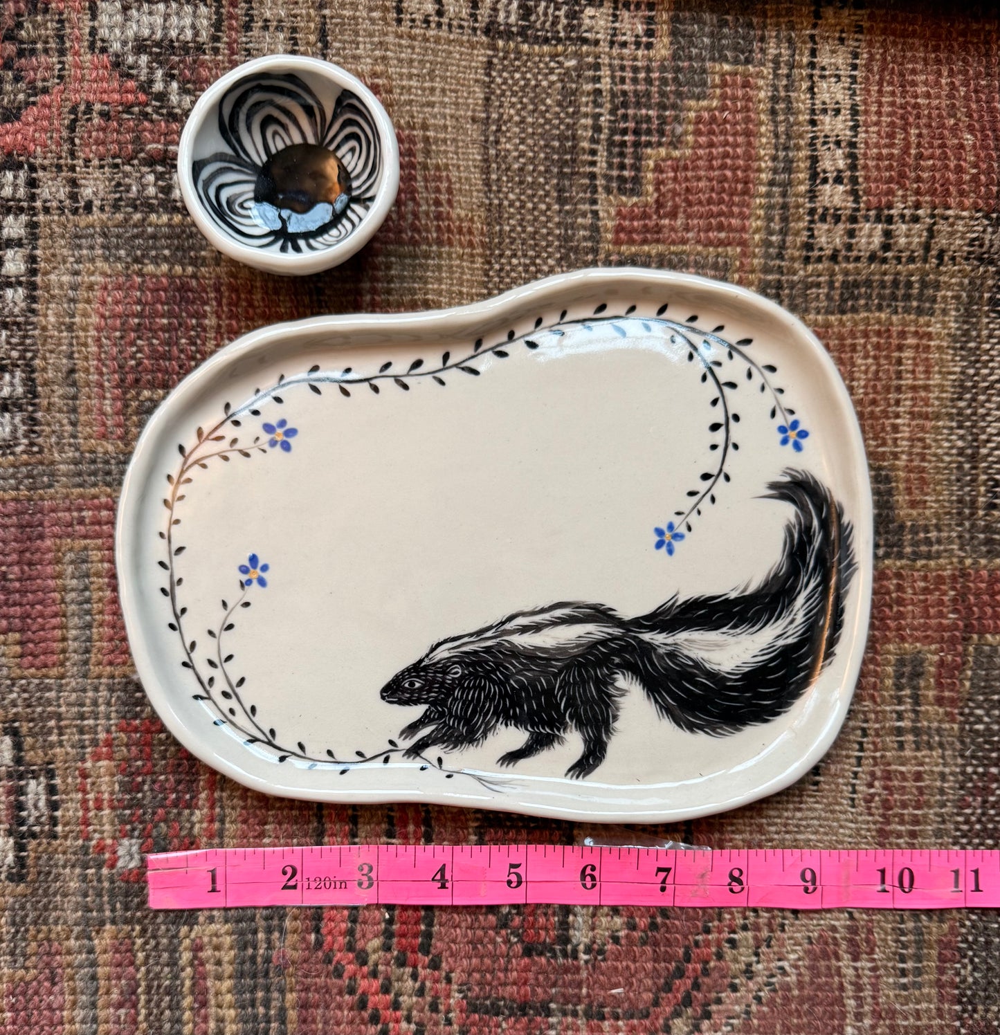 Skunk snack plate with condiment bowl