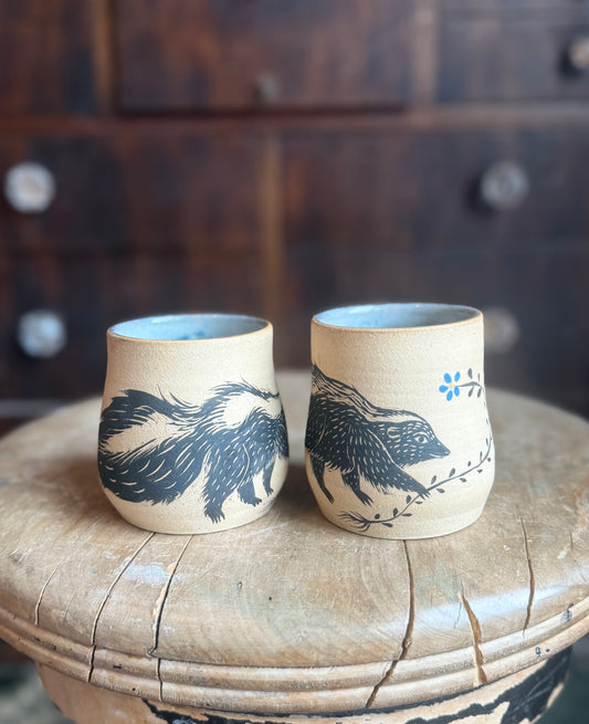 Pair of skunks cup set